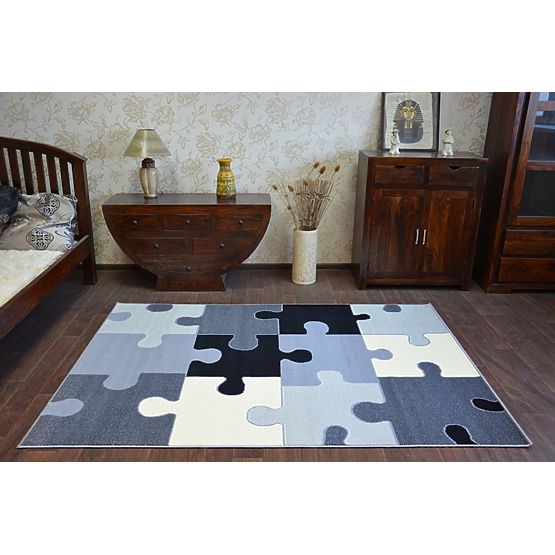 Dětský koberec Puzzle šedý